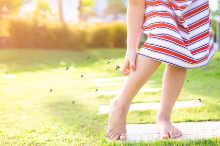 mosquitoes annoying girl playing outside